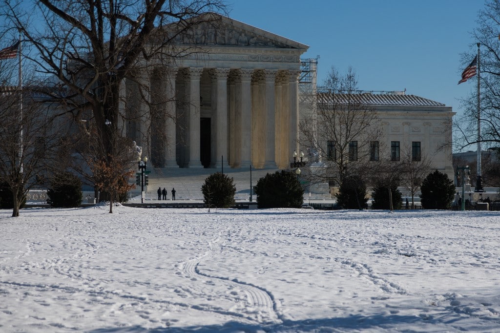The U.S. Supreme Court building in Washington, D.C. is seen from snow-covered U.S. Capitol grounds on January 17, 2024. (Photo by Bryan Olin Dozier/NurPhoto) (Photo by Bryan Olin Dozier / NurPhoto / NurPhoto via AFP)
